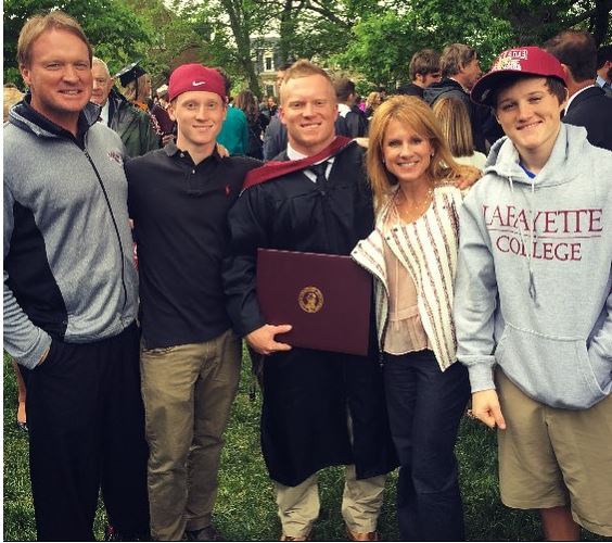 Cindy Gruden with her husband & sons